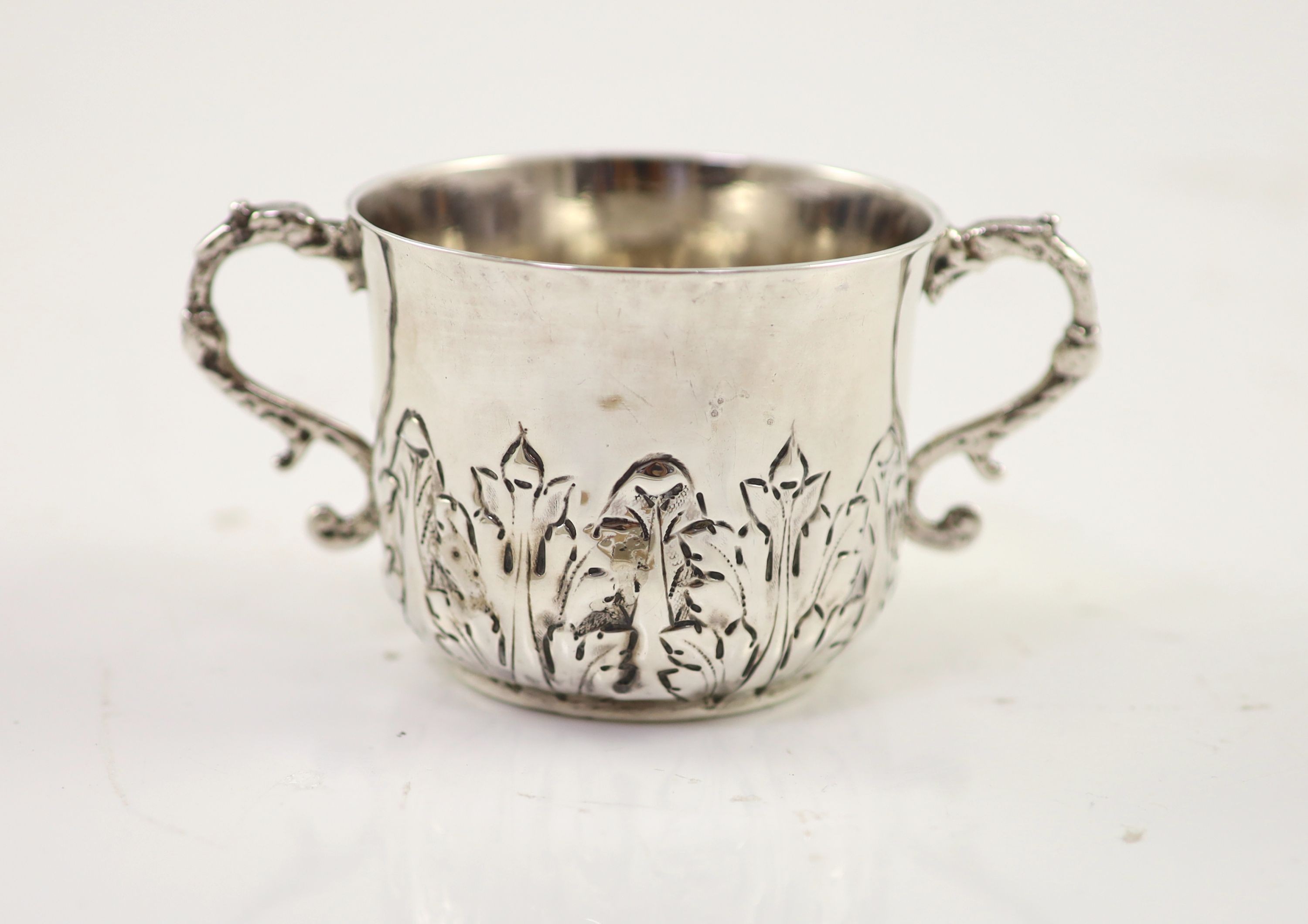 A William III repousse silver porringer, by Jonah Kirk, London c.1695
